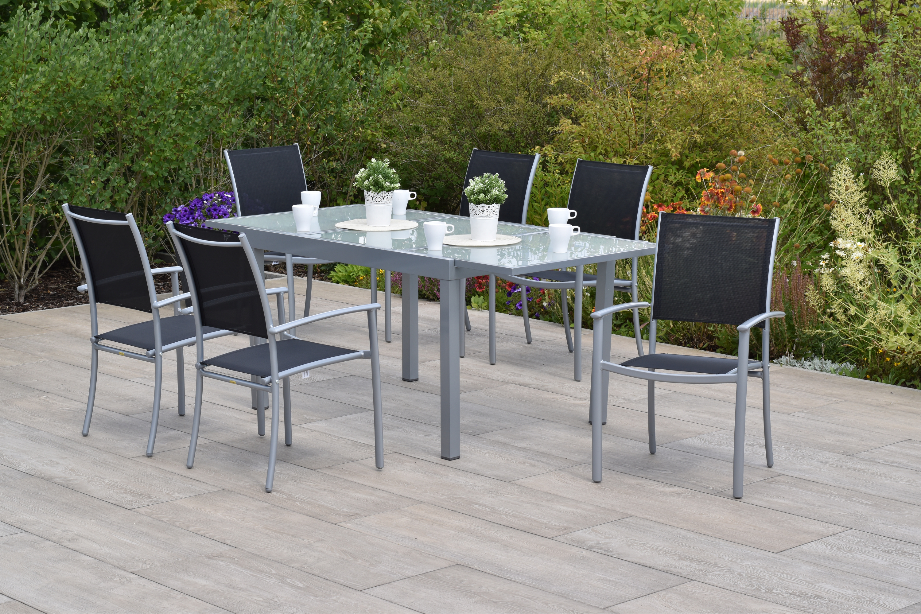 Milano Set 7tlg., 6 Stapelsessel, Ausziehtisch 120 (180) x 90 cm, silber/schwarz